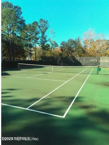 a view of green landscape from a lake