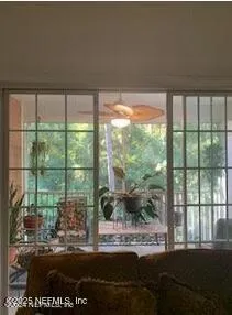 a view of a porch with a floor to ceiling window