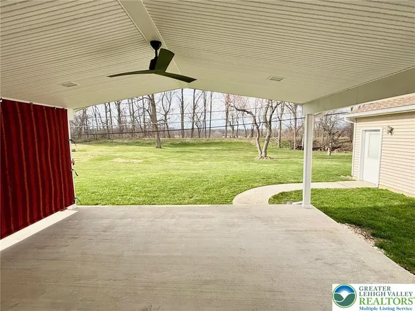 a view of a porch with a garden
