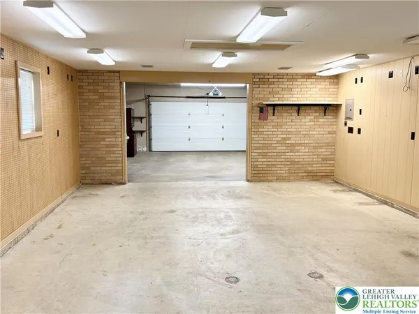 a view of room with window and door