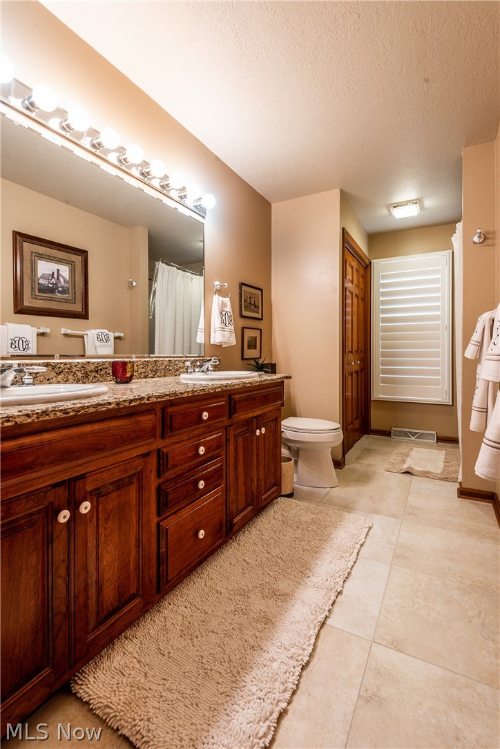 1814 Summerchase Road Northeast Canton, OH 44721 - Photo 21 of 34 Master bath has granite counters and offers double sinks
