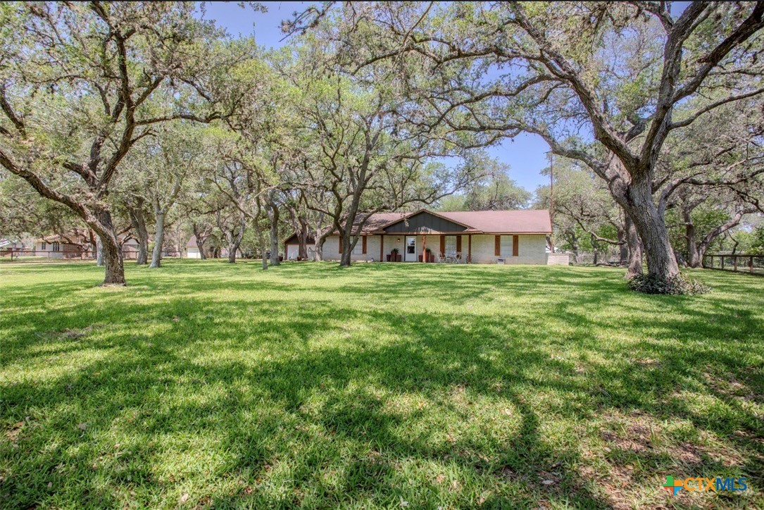 188 Cavalry Road Victoria, TX 77905 - Photo 3 of 30 a front view of a house with garden