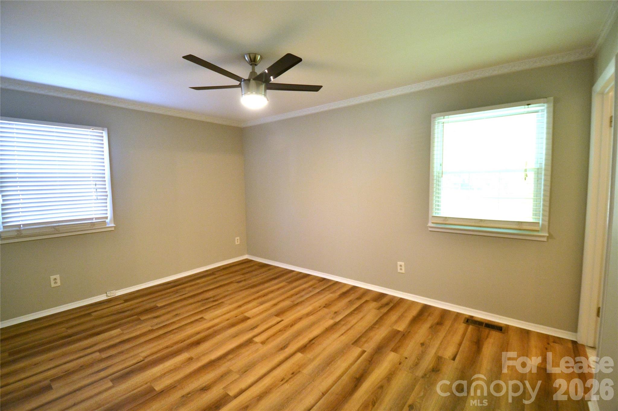 1422 Thermal Road Charlotte, NC 28212 - Photo 25 of 40 a view of an empty room with wooden floor and a window