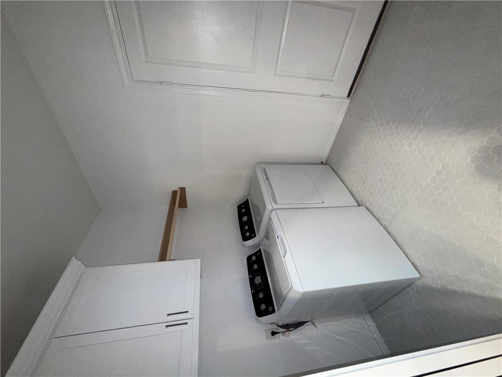 3533 Leesburg Path Bryan, TX 77808 - Photo 13 of 28 a view of storage and utility room with washer and dryer