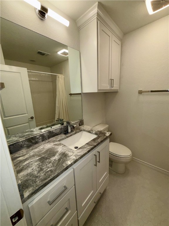 3533 Leesburg Path Bryan, TX 77808 - Photo 19 of 28 a bathroom with a granite countertop sink a toilet and a mirror