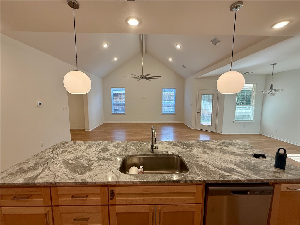 3533 Leesburg Path Bryan, TX 77808 - Photo 26 of 28 a bathroom with a granite countertop sink a counter and window