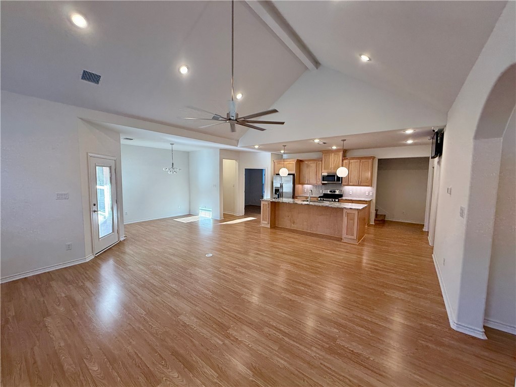 3533 Leesburg Path Bryan, TX 77808 - Photo 5 of 28 a view of a kitchen with a sink and a refrigerator