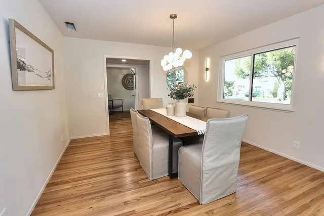 a stove top oven sitting inside of a kitchen