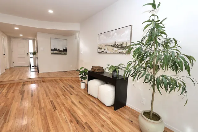 a view of a livingroom with furniture and windows