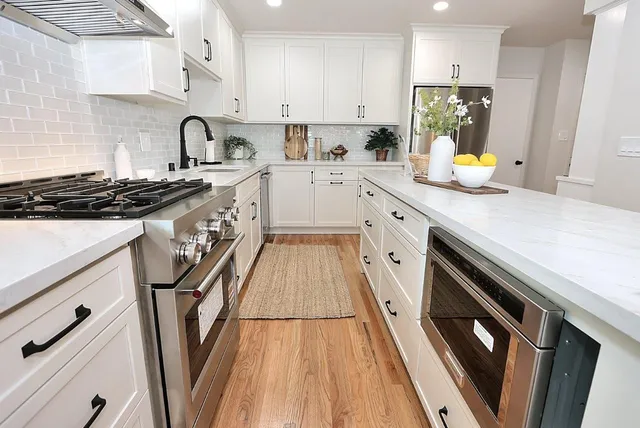a bathroom with a toilet sink vanity and mirror