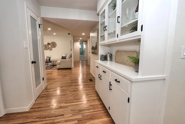 a bathroom with a double vanity sink toilet and shower