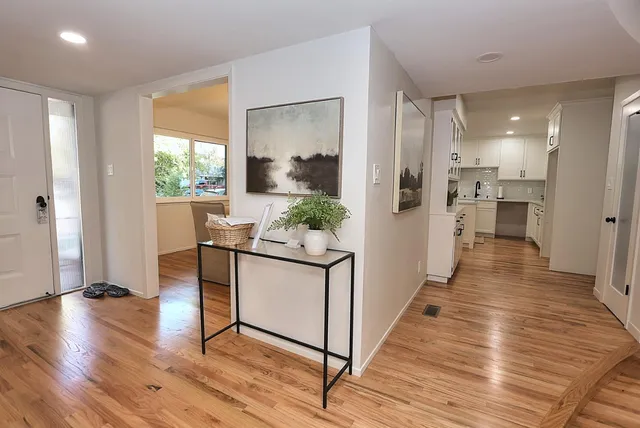 a bathroom with a double vanity sink toilet and shower