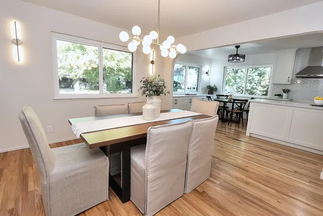 a view of a backyard with garden and patio