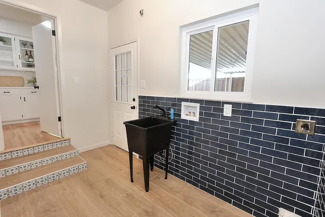 a view of a patio with a table and chairs