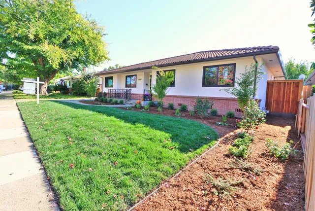 a view of washer and dryer with wooden floor