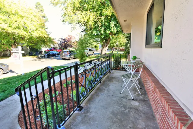 a kitchen with a table chairs and wooden floor