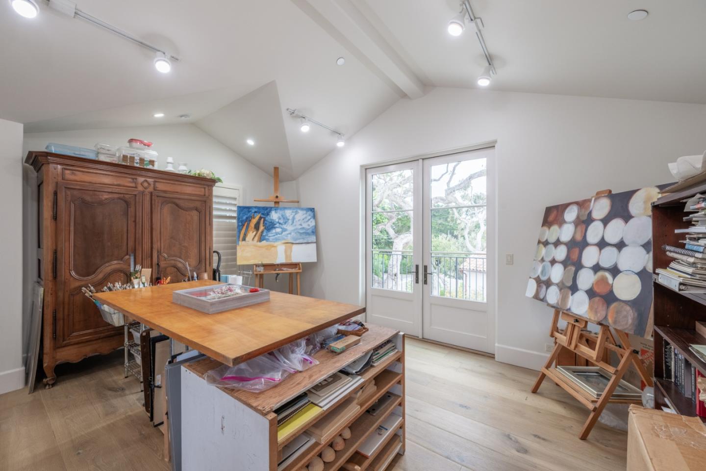 1041 Rodeo Road Pebble Beach, CA 93953 - Photo 14 of 18 a kitchen that has a table and chairs in it