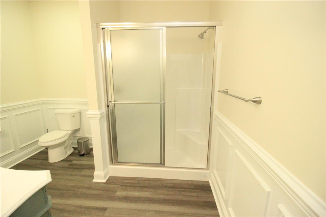 3083 Penn Allen Road, Unit B Nazareth, PA 18064 - Photo 7 of 21 Functional full bathroom featuring a glass-enclosed shower and wainscoting.