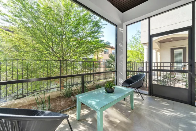 a bedroom with a bed and a lamp on table