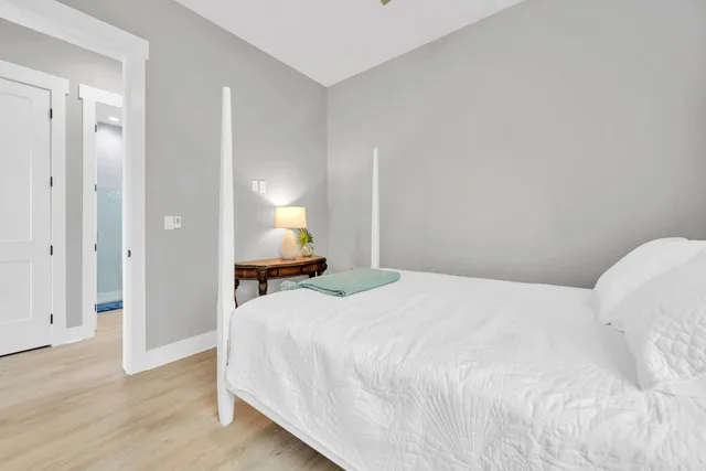 a white bath tub sitting next to a white shower and a sink