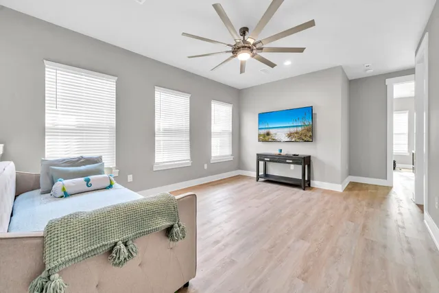 a spacious bedroom with a large bed and a window