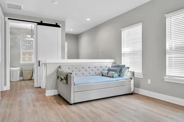 a view of a patio with table and chairs under an umbrella