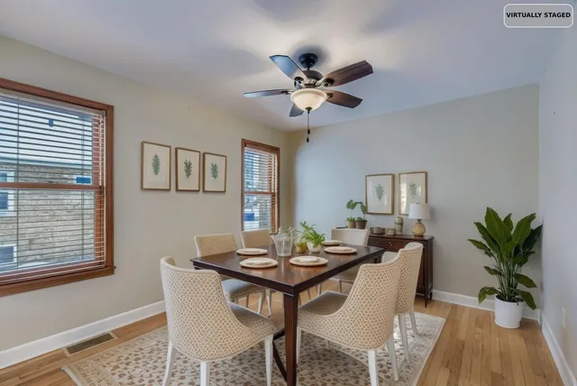 a bedroom with bed and a potted plant