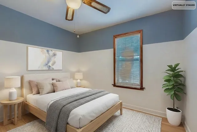 a bedroom with bed and a window