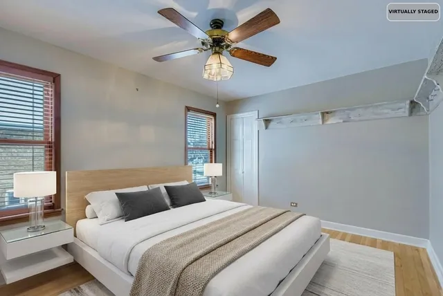 a bedroom with a bed and a painting on the wall