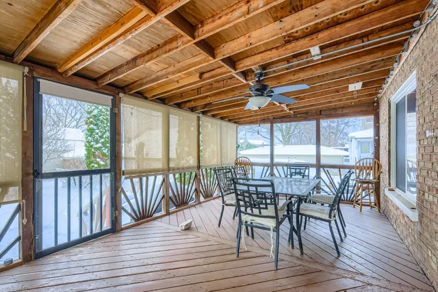 a patio of a house with table and chairs