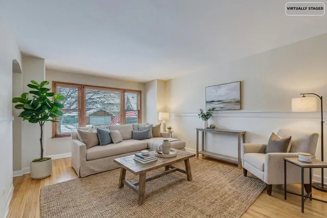 a dining hall with stainless steel appliances granite countertop a sink and a refrigerator