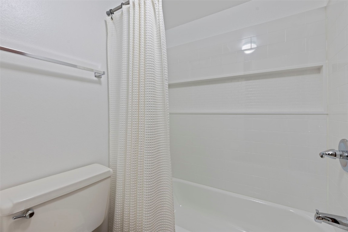 7307 Ryan Gulch Road, Unit 7307 Silverthorne, CO 80498 - Photo 11 of 20 a bathroom with a shower and toilet
