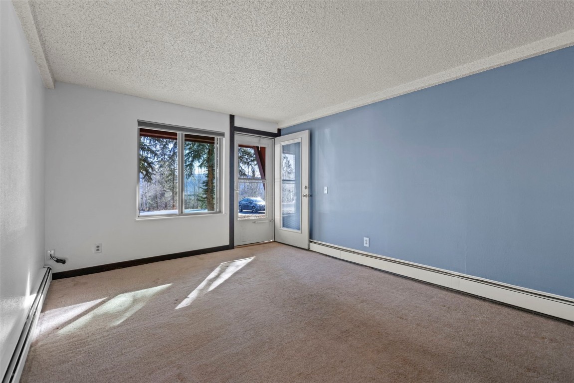 7307 Ryan Gulch Road, Unit 7307 Silverthorne, CO 80498 - Photo 16 of 20 an empty room with windows