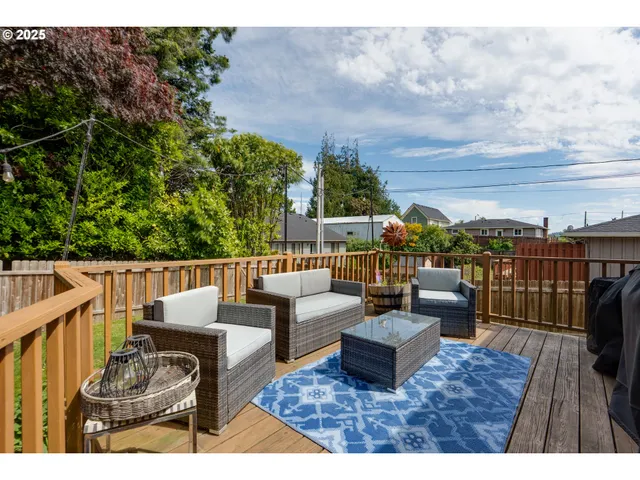 a view of roof deck with couches and city view