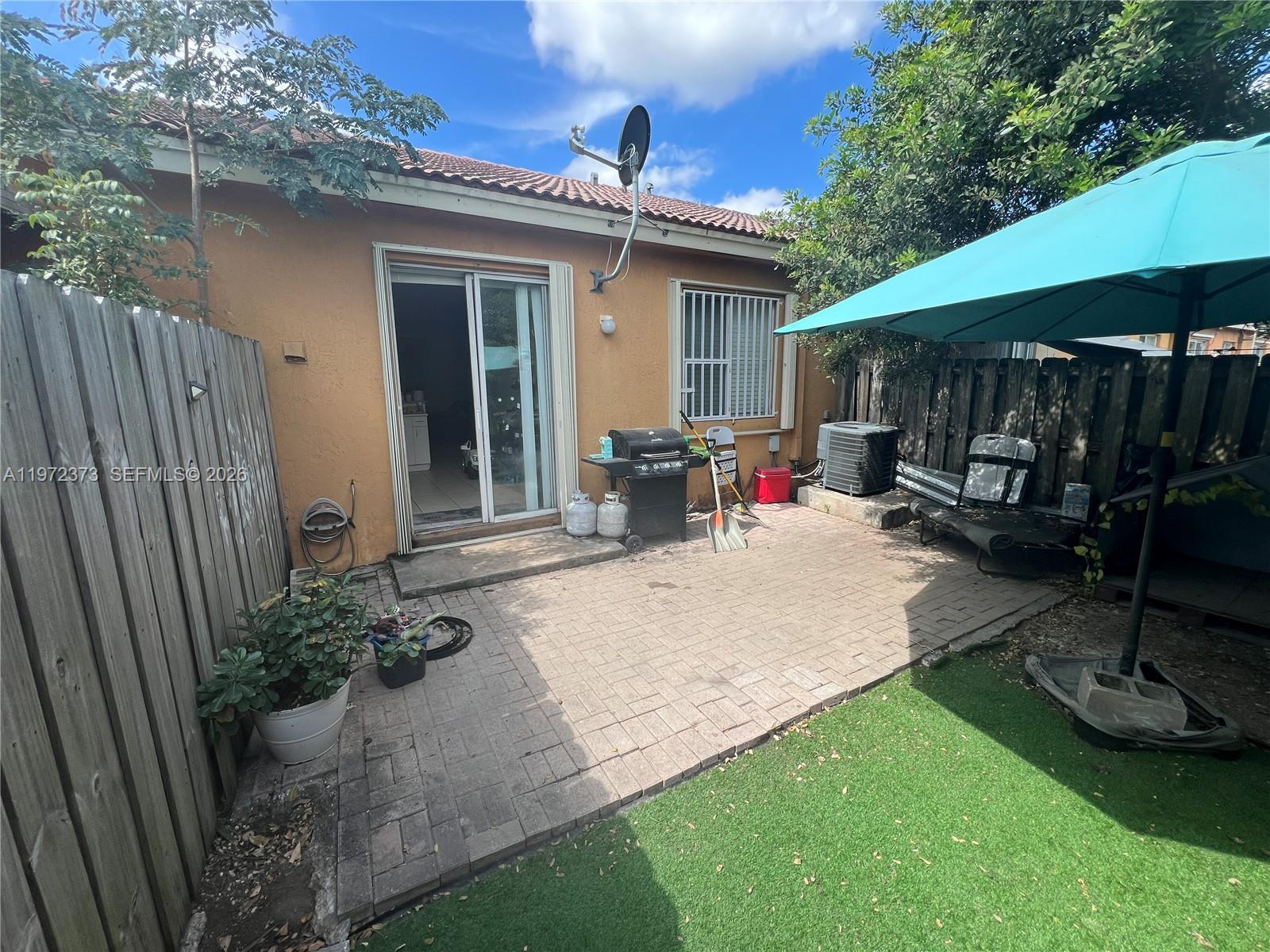 45 Southwest 14th Terrace Homestead, FL 33030 - Photo 2 of 40 a view of a backyard with sitting area and furniture