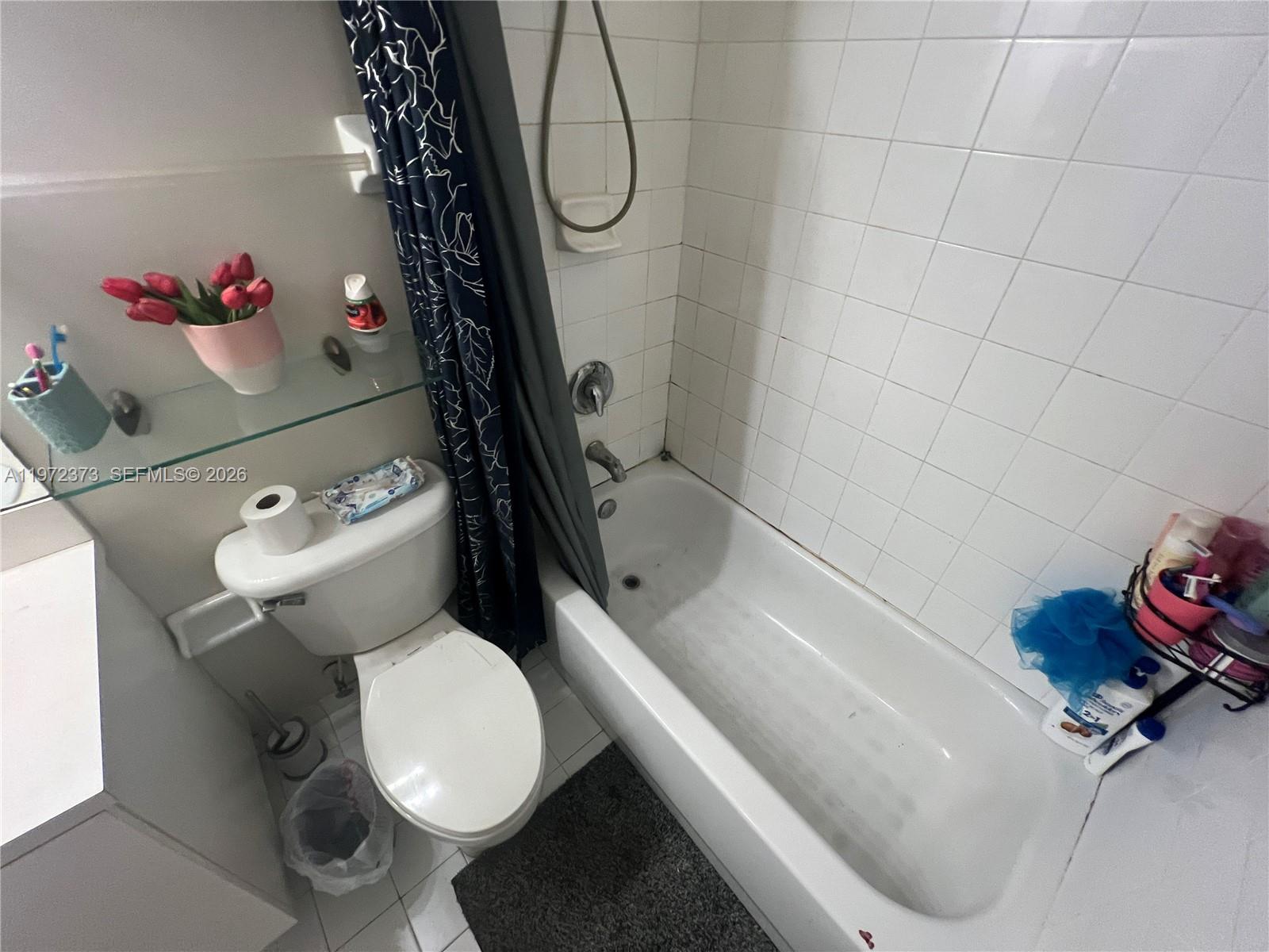 45 Southwest 14th Terrace Homestead, FL 33030 - Photo 36 of 40 a bathroom with a sink toilet and a shower