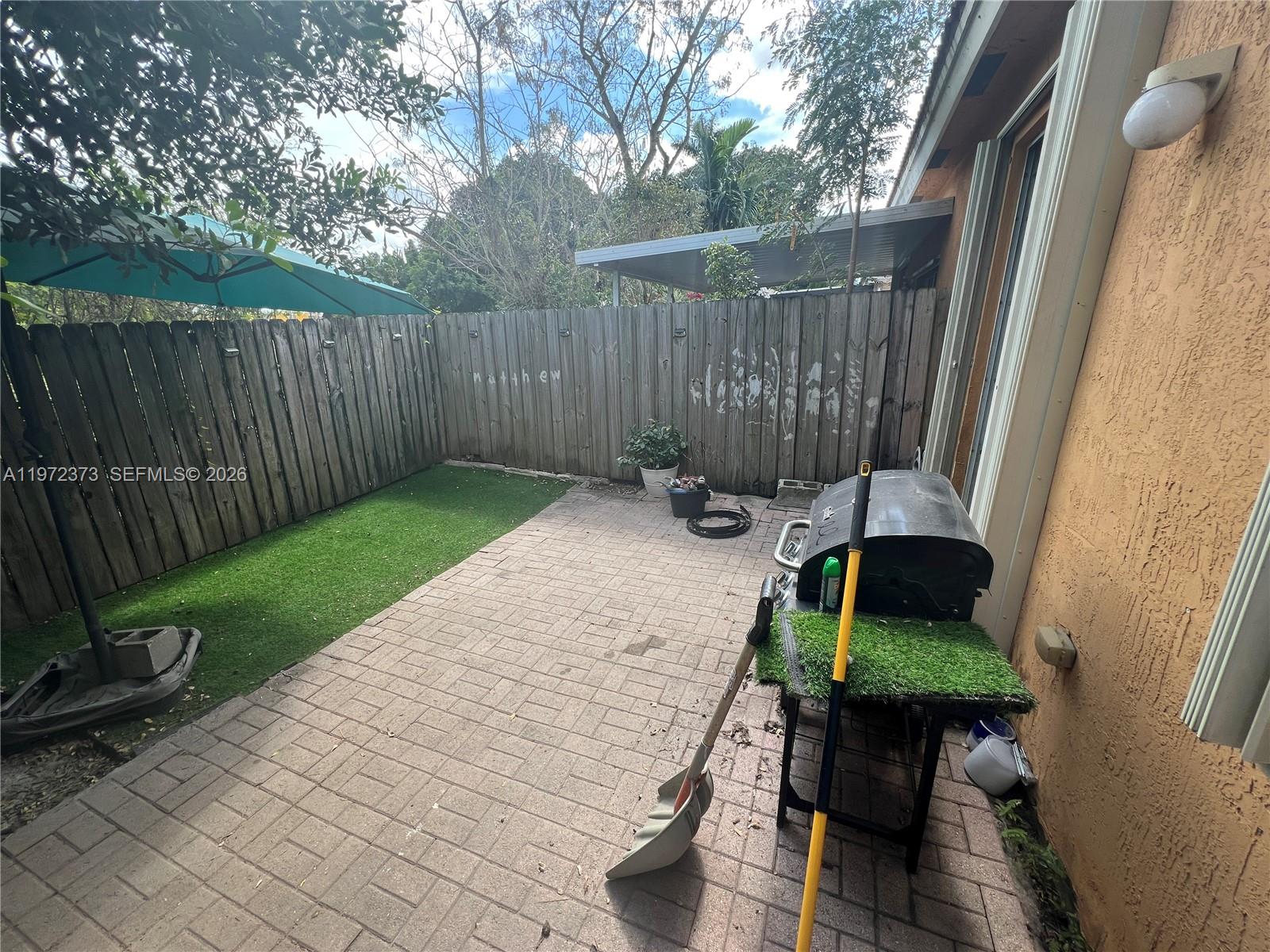 45 Southwest 14th Terrace Homestead, FL 33030 - Photo 4 of 40 a view of a backyard with furniture