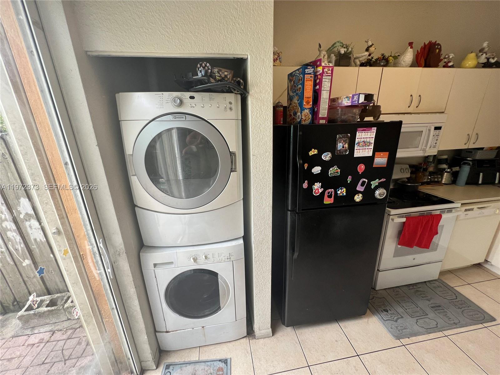 45 Southwest 14th Terrace Homestead, FL 33030 - Photo 7 of 40 a utility room with dryer and washer