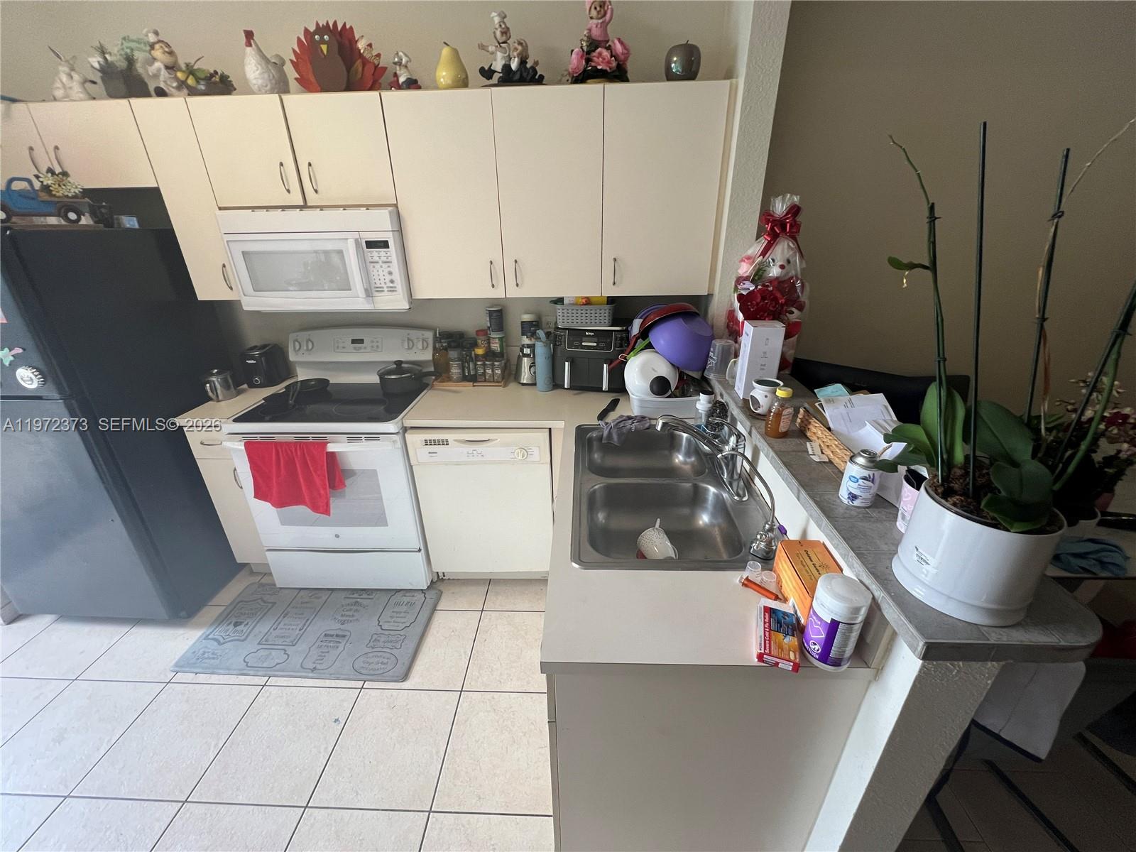 45 Southwest 14th Terrace Homestead, FL 33030 - Photo 10 of 40 a utility room with dryer and washer