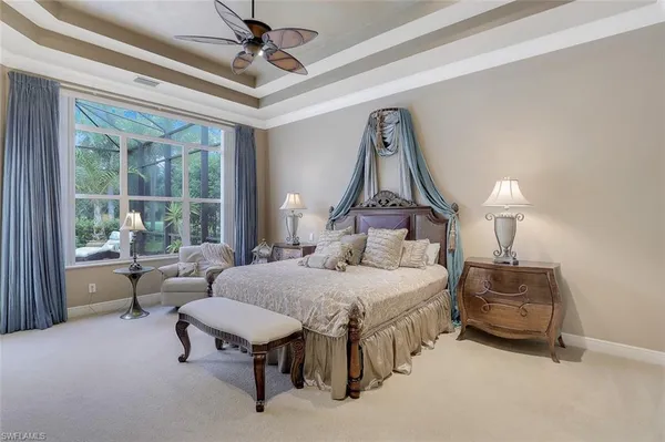 a bedroom with bed and window