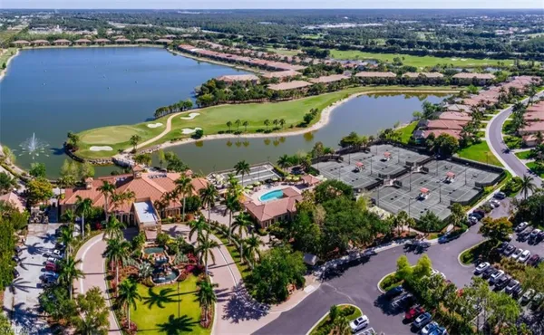 an aerial view of a houses with a lake view