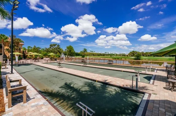 a view of a swimming pool with outdoor seating