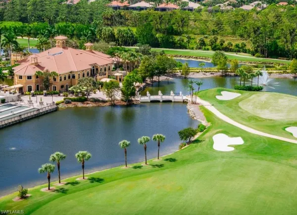 a view of a lake with a house swimming pool and outdoor space