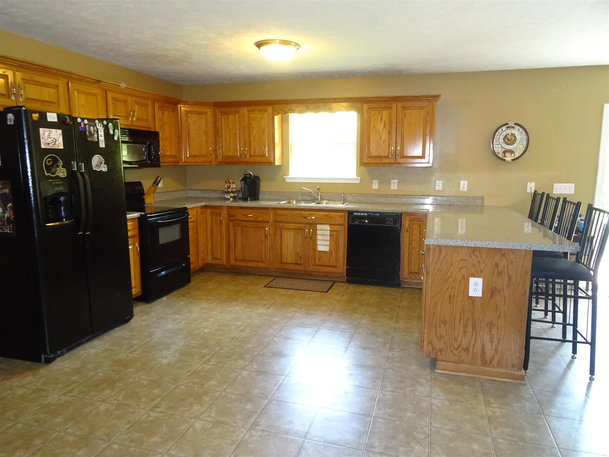 1246 Dillon Road Milton, TN 37118 - Photo 3 of 29 a large kitchen with lot of cabinets and stainless steel appliances