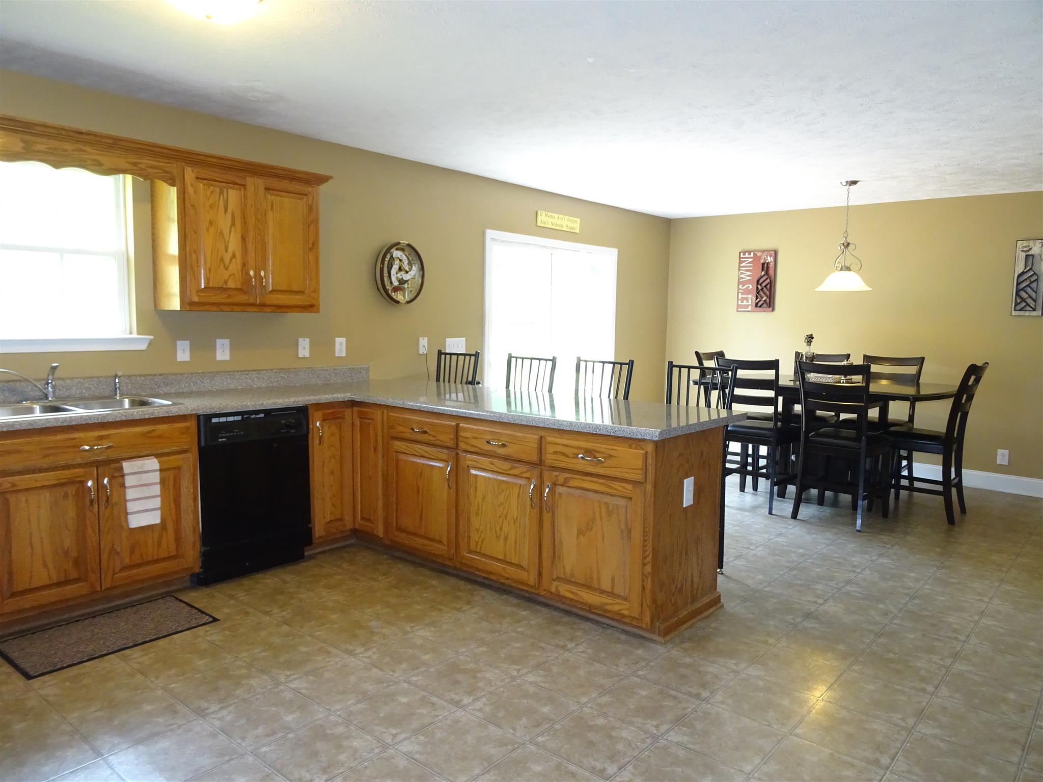 1246 Dillon Road Milton, TN 37118 - Photo 5 of 29 a kitchen with stainless steel appliances granite countertop a sink and a refrigerator