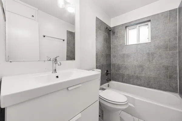 a bathroom with a sink a toilet and a bathtub