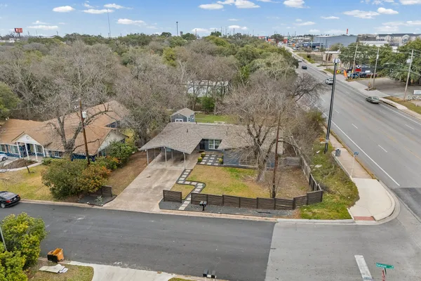an aerial view of residential houses with outdoor space