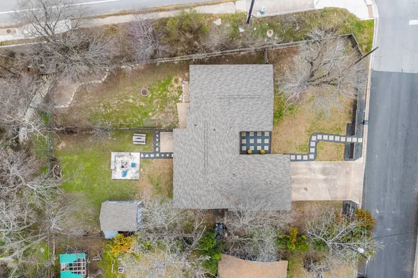 an aerial view of a residential houses with outdoor space