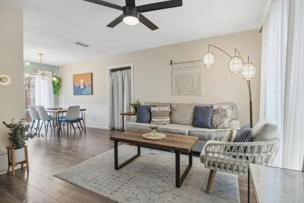 a living room with furniture and a rug