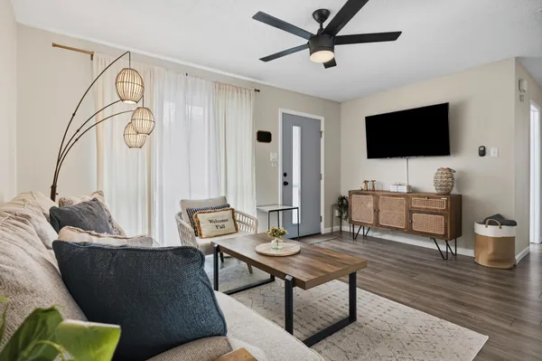 a living room with furniture and a flat screen tv